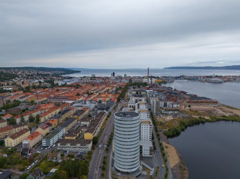 Stunning aerial shot of Jönköping, Sweden, showcasing cityscape and calm lake.